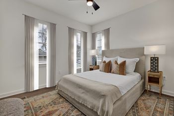 Bedroom with natural light and ceiling fan at West Row Townhomes and